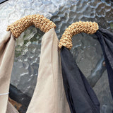 Bolso de mano triangular